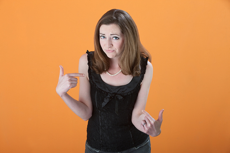 Woman pointing at self