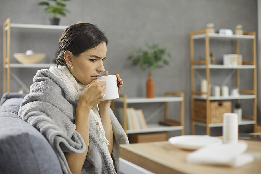 Tired Woman on the Sofa with Coffee