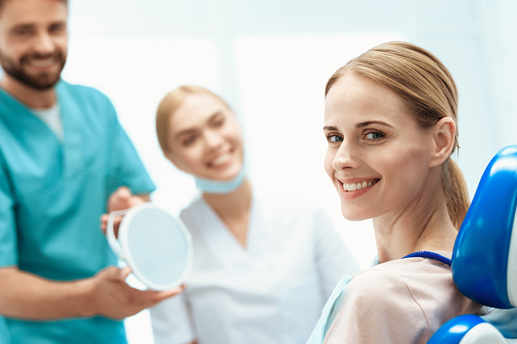 Woman sitting in dentists chair