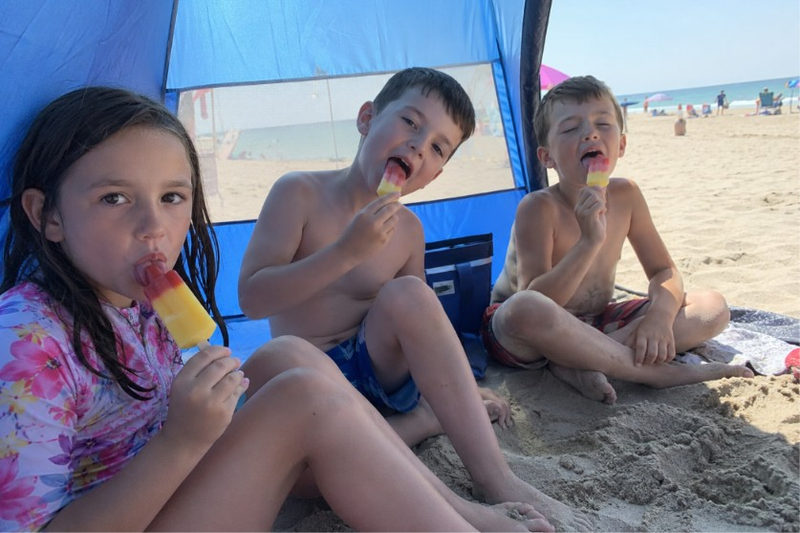 Kids Eating Ice Lollies in the Shade