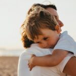 mother hugging young boy