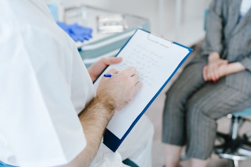 medical professional with clip board