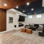 a living room with a couch a chair and a flat screen tv