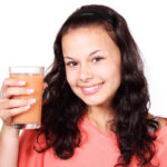 Smiling Woman With health Drink