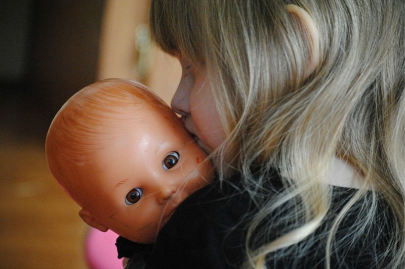 Girl Playing with Doll